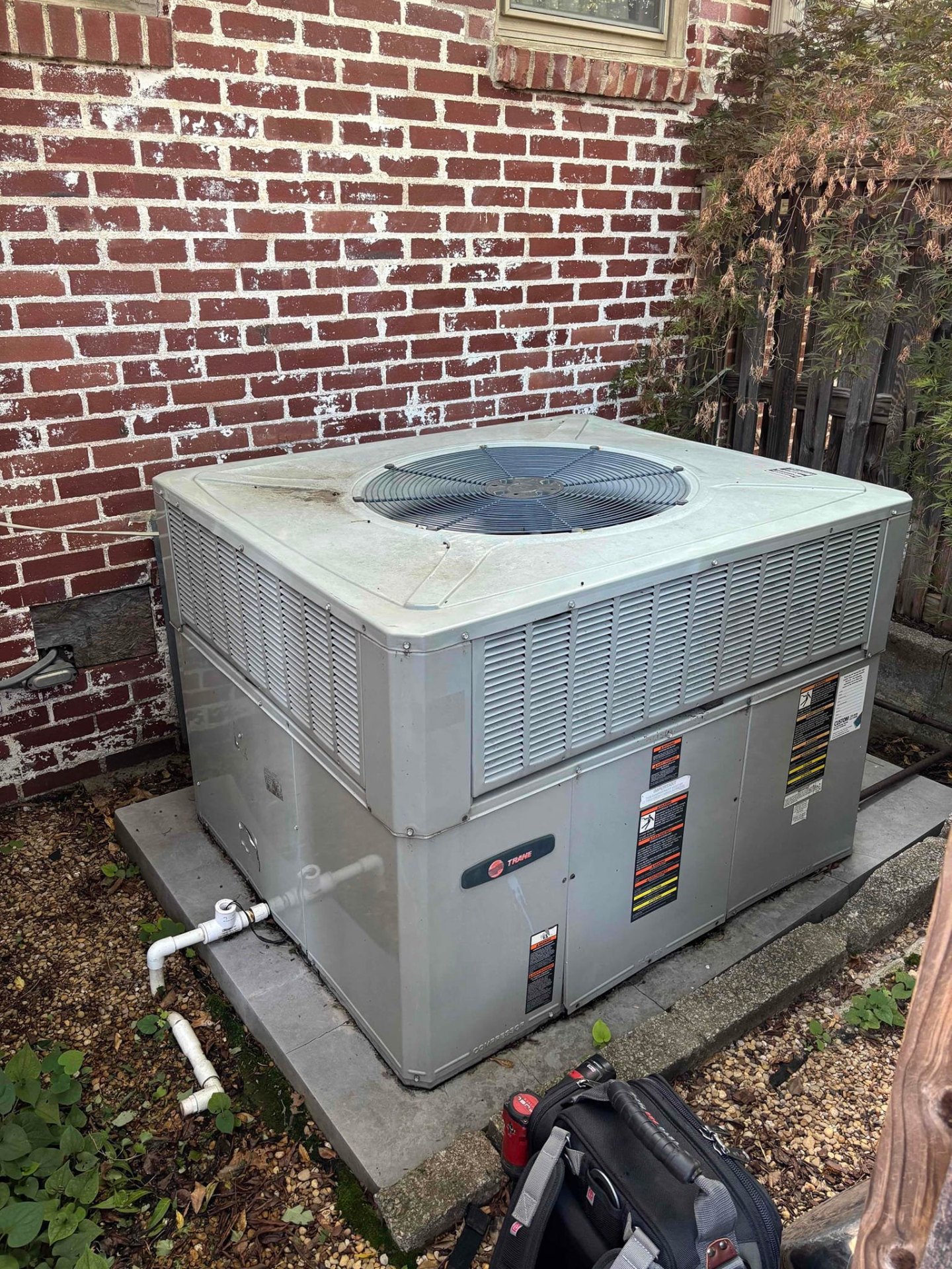 Trane packaged AC unit outside a Tulsa home ready for repair